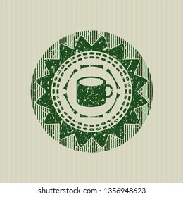 Green coffee cup icon inside rubber grunge seal