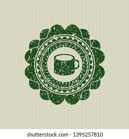 Green coffee cup icon inside distressed rubber seal with grunge texture