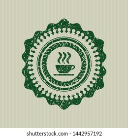 Green coffee cup icon inside distressed rubber grunge seal