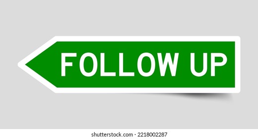 Green color arrow shape sticker label with word follow up on gray background