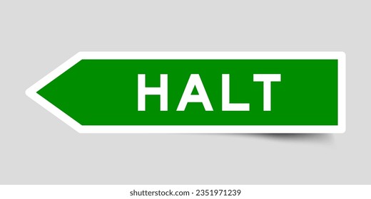 Green color arrow shape sticker label with word halt on gray background