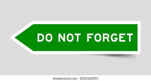 Green color arrow shape sticker label with word do not forget on gray background