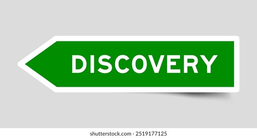 Green color arrow shape sticker label with word discovery on gray background