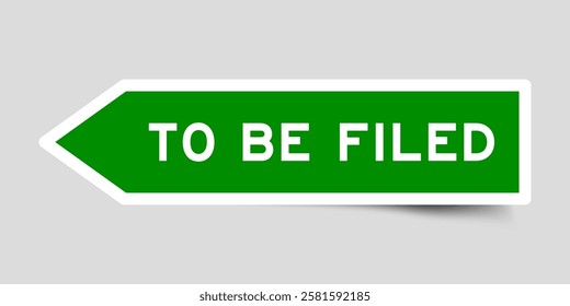 Green color arrow shape sticker label with word to be filed on gray background