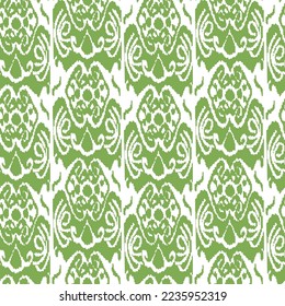 Green color ikat pattern for fabrics and for other creative things. Traditional textile product in Uzbekistan. 