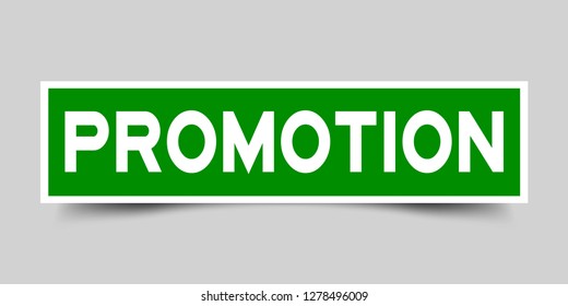 Green color label sticker in word promotion on gray background