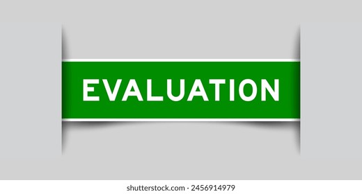 Green color square label sticker with word evaluation that inserted in gray background
