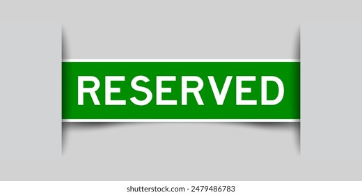 Green color square label sticker with word reserved that inserted in gray background