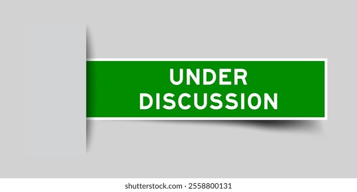 Green color square label sticker with word under discussion that inserted in gray background