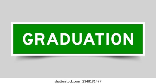 Green color square shape sticker label with word graduation on gray background