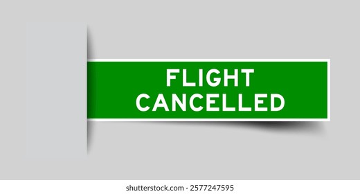 Green color square shape sticker label with word flight cancelled inserted in gray background