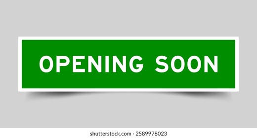 Green color square shape sticker label with word opening soon on gray background