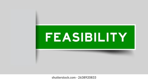Green color square shape sticker label with word feasibility inserted in gray background
