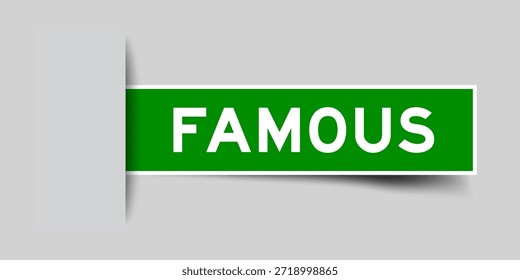 Green color square shape sticker label with word famous inserted in gray background