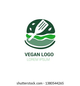Green colored vegan burger symbol, logo, icon on white background with a leafs on top and spatula. Perfect for vegan, vegetarian kitchen and restaurant 