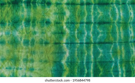 green colorful tie dye pattern cotton fabric clothing texture .decorative bright artistic abstract graffiti background wallpaper design. 
