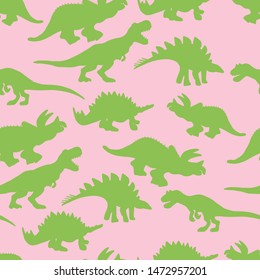 Green colour dinosaurs silhouette seamless pattern on pink background. Vector Illustration