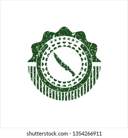 Green combat knife icon inside rubber grunge seal
