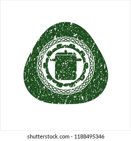Green cooking pot icon inside distressed rubber seal with grunge texture