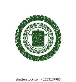 Green cooking pot icon inside distressed rubber stamp