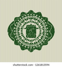Green cooking pot icon inside distressed rubber grunge stamp