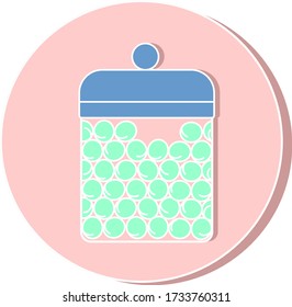 Green cotton balls in a close glass jar with blue lid on circle pink space isolated on white background.