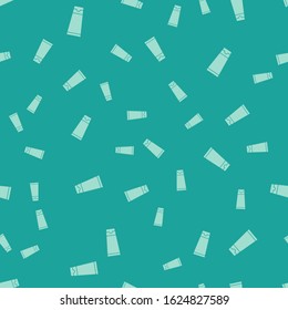 Green Cream or lotion cosmetic tube icon isolated seamless pattern on green background. Body care products for men.  Vector Illustration