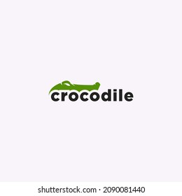logotipo de cocodrilo verde espacio negativo