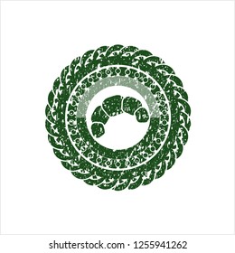 Green croissant icon inside distress rubber grunge stamp