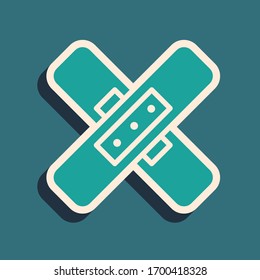 Green Crossed bandage plaster icon isolated on green background. Medical plaster, adhesive bandage, flexible fabric bandage. Long shadow style. Vector Illustration