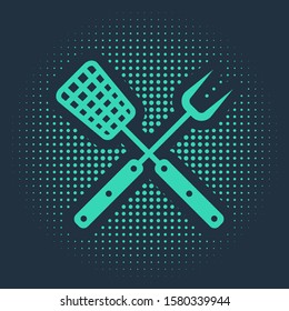 Green Crossed fork and spatula icon isolated on blue background. BBQ fork and spatula sign. Barbecue and grill tools. Abstract circle random dots. Vector Illustration