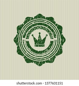 Green crown icon inside distressed rubber texture