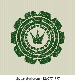 Green crown icon inside grunge seal