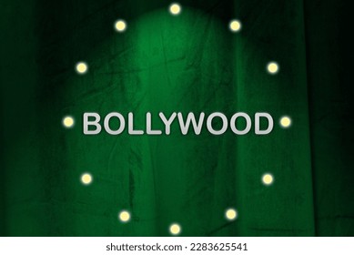 Green curtain with bulb lights, spotlight and Bollywood silver colored lettering. Illustration made April 2nd, 2023, Zurich, Switzerland.