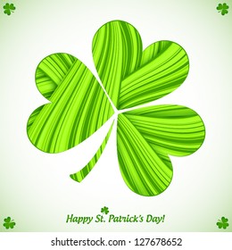 Green cutout striped paper clover on white background Saint Patrick's greeting card