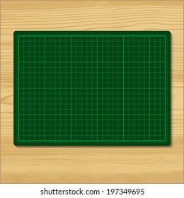 Green cutting mat isolated on  wood background.    Vector illustration.