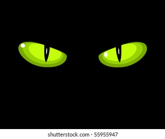 Green dangerous wild cat eyes in darkness