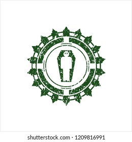 Green dead man in his coffin icon inside distress rubber seal with grunge texture