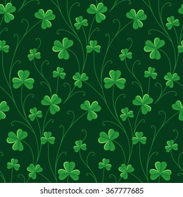 Green decorative clover on dark green background. Seamless pattern for St. Patrick's day