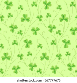 Green decorative clover on light green background. Seamless pattern for St. Patrick's day