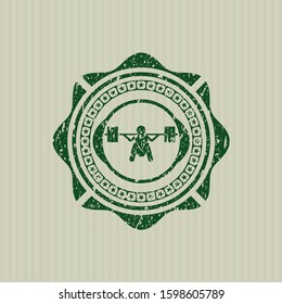 Green deep squat icon inside distressed rubber stamp with grunge texture
