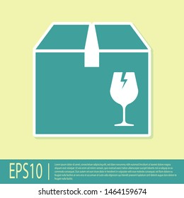 Green Delivery package box with fragile content symbol of broken glass icon isolated on yellow background. Box, package, parcel sign.  Vector Illustration