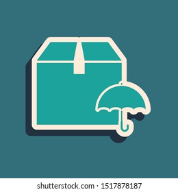 Green Delivery package with umbrella symbol icon isolated on blue background. Parcel cardboard box with umbrella sign. Logistic and delivery. Long shadow style. Vector Illustration