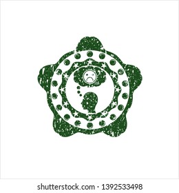 Green depression icon inside distressed rubber seal