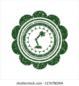 Green desk lamp icon inside distress rubber grunge texture seal