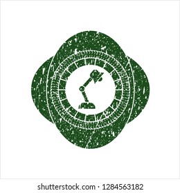 Green desk lamp icon inside distress rubber texture
