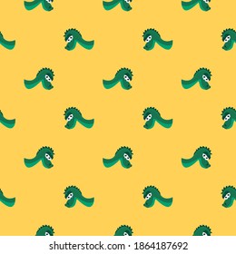 Green dinosaur heads,seamless pattern on yellow background.