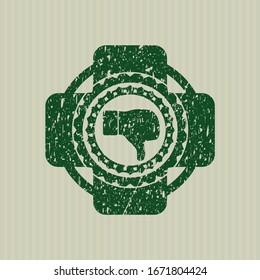 Icono de disgusto verde dentro del sello de textura de hule de goma con problemas