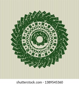 Green donut icon inside distress rubber grunge texture stamp