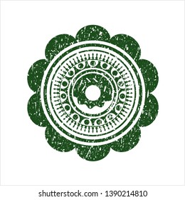 Green donut icon inside distressed grunge stamp